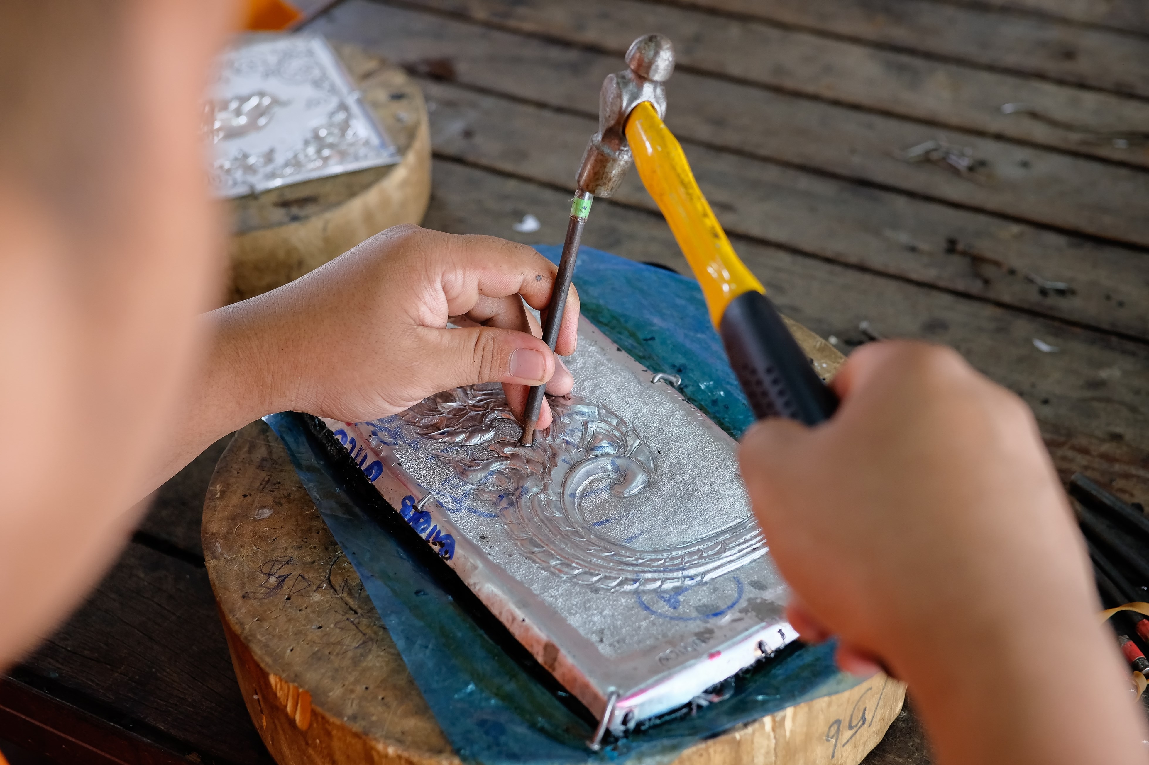 A man making silverware in chiangmai, Thai hand craft silverware