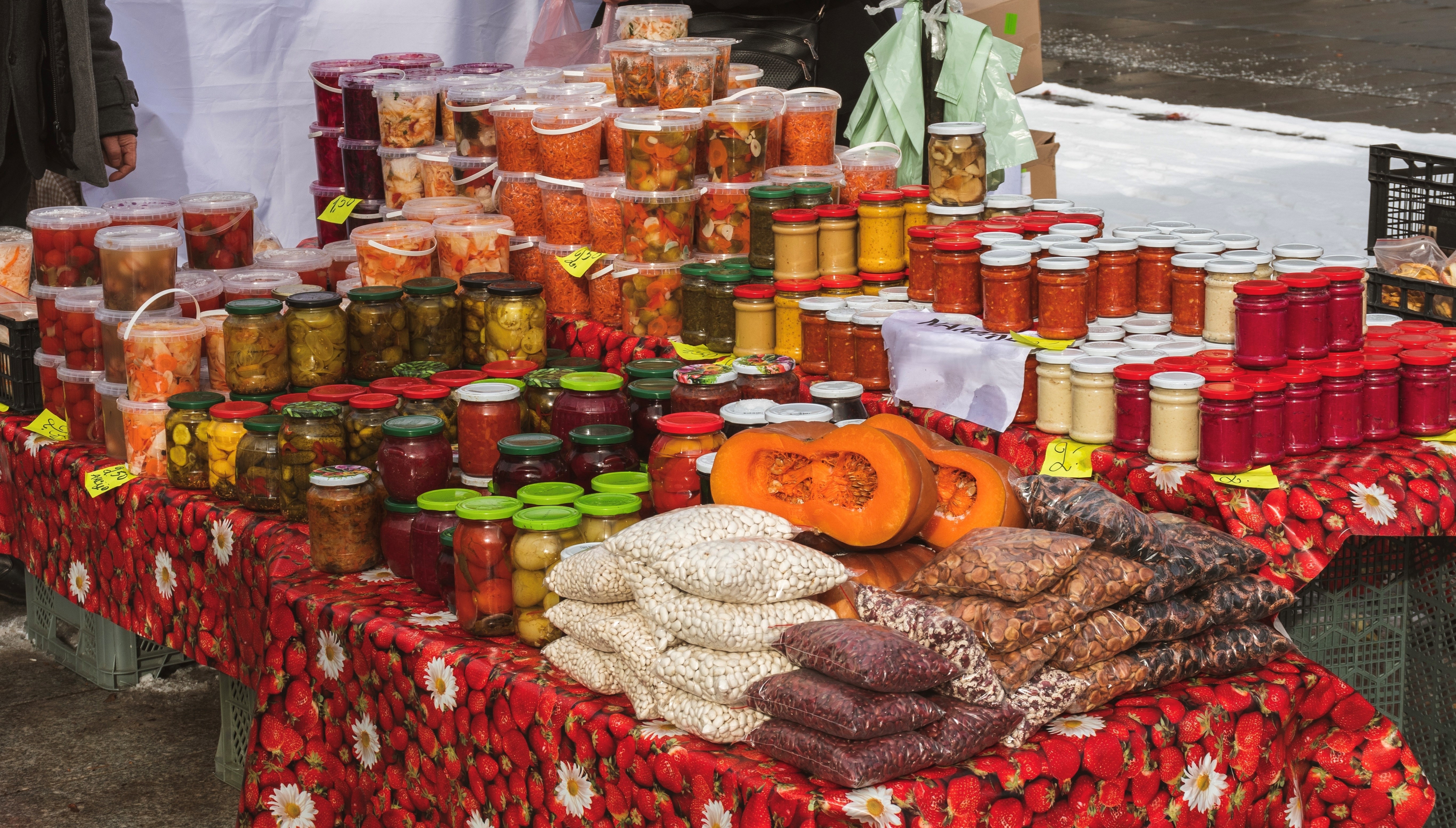 Selling various pickled or marinated vegetables, beans and berries